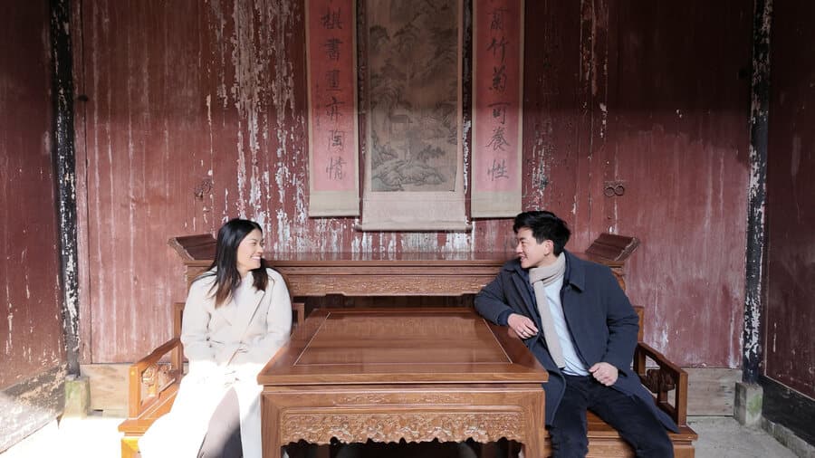 Sitting together in a red temple hall
